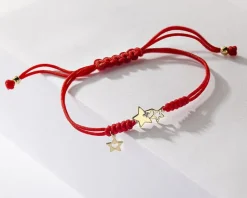 Apart Bransoletka z elementami żółtego złota i diamentem - gwiazdy - 0,005 ct - próba 375< Bransoletki Z Diamentami