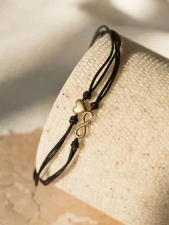Sale Apart Bransoletka z elementami żółtego złota i diamentem - nieskończoność, serce - 0,004 ct - próba 375