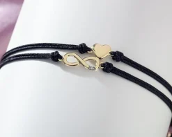 Sale Apart Bransoletka z elementami żółtego złota i diamentem - nieskończoność, serce - 0,004 ct - próba 375