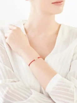 Apart Bransoletka z elementami żółtego złota i diamentami - skrzydło - 0,01 ct - próba 375< Bransoletki Z Diamentami