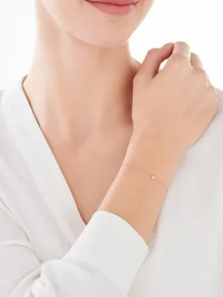 Apart Bransoletka z różowego i białego złota z diamentem - 0,007 ct - próba 375< Bransoletki Z Diamentami