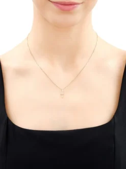 Outlet Apart Zawieszka z żółtego złota z diamentami - krzyż - 0,02 ct - próba 585